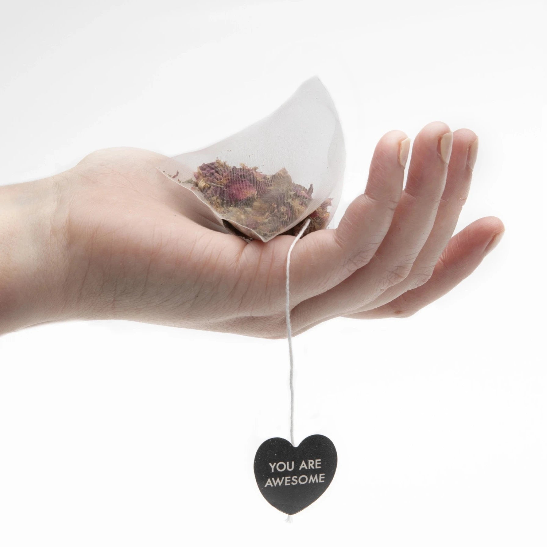 hand holding tea bag