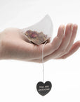 hand holding tea bag