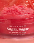 lip scrub surrounded by grapefruit 