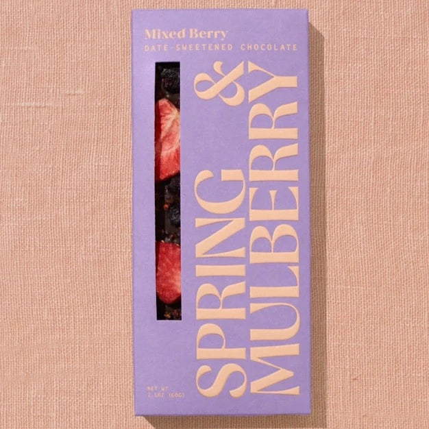 A rectangular chocolate bar packaged in lavender paper with beige text reading, "Mixed Berry"