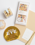 contents of BOXFOX Birthday Gift Box: Sugarfina Birthday Cake Batter Chocolate Bar, Notem Ochre Lines Notebook, Voluspa Bergamot Rose Macaron Candle, Vitamasques Gold Eye Pads, Sugarfina Birthday Cake Cookies, BOXFOX Gold Bullet Pen