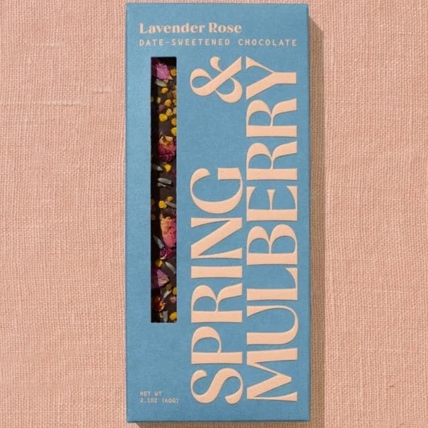 A rectangular chocolate bar packaged in sky blue paper with beige text reading "Lavender Rose"