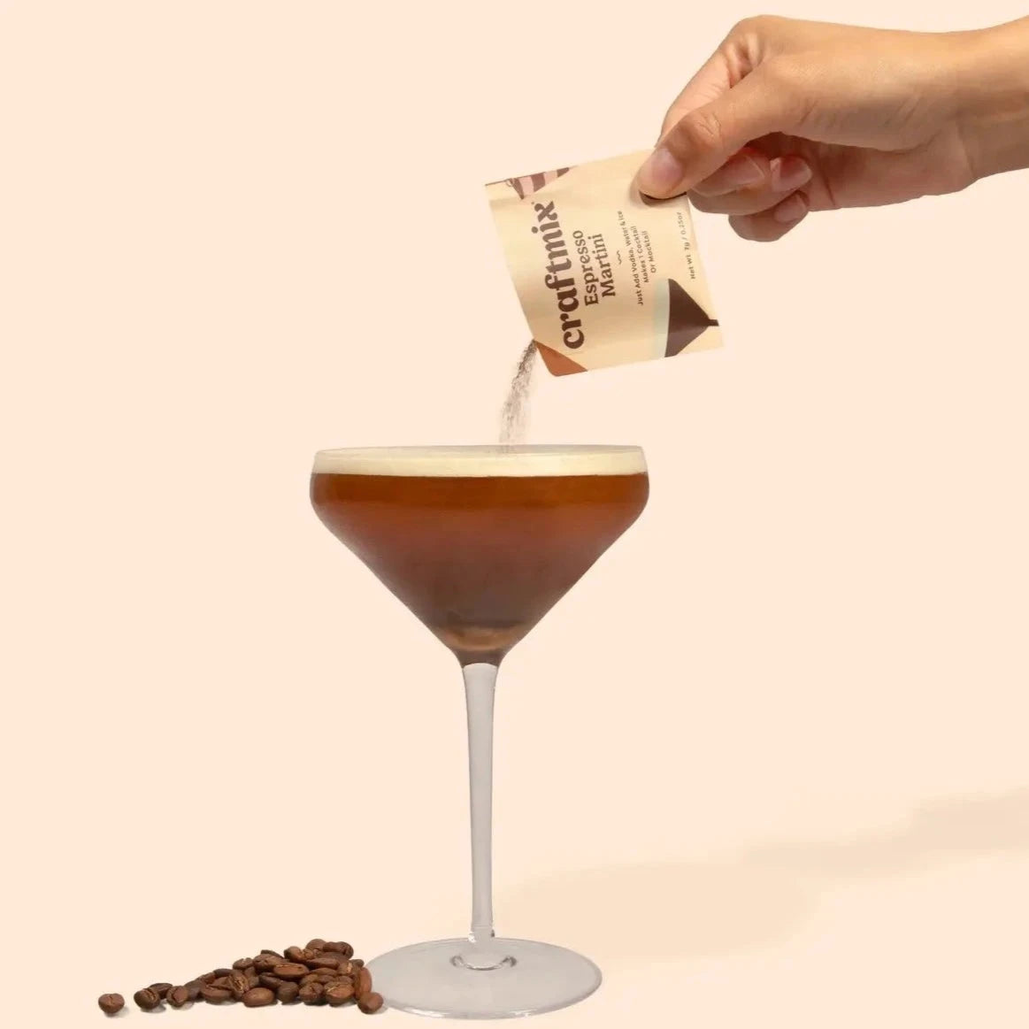 Espresso martini glass with hand pouring mix into it