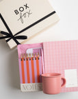 BOXFOX Original Creme Box with Notem Medium Vita Notebook - Rose, BOXFOX Camellia Pink Mug, BOXFOX Pink Bullet Pen, Designworks Pink & Orange Striped Notepad, and Touchland Berry Bliss Power Mist