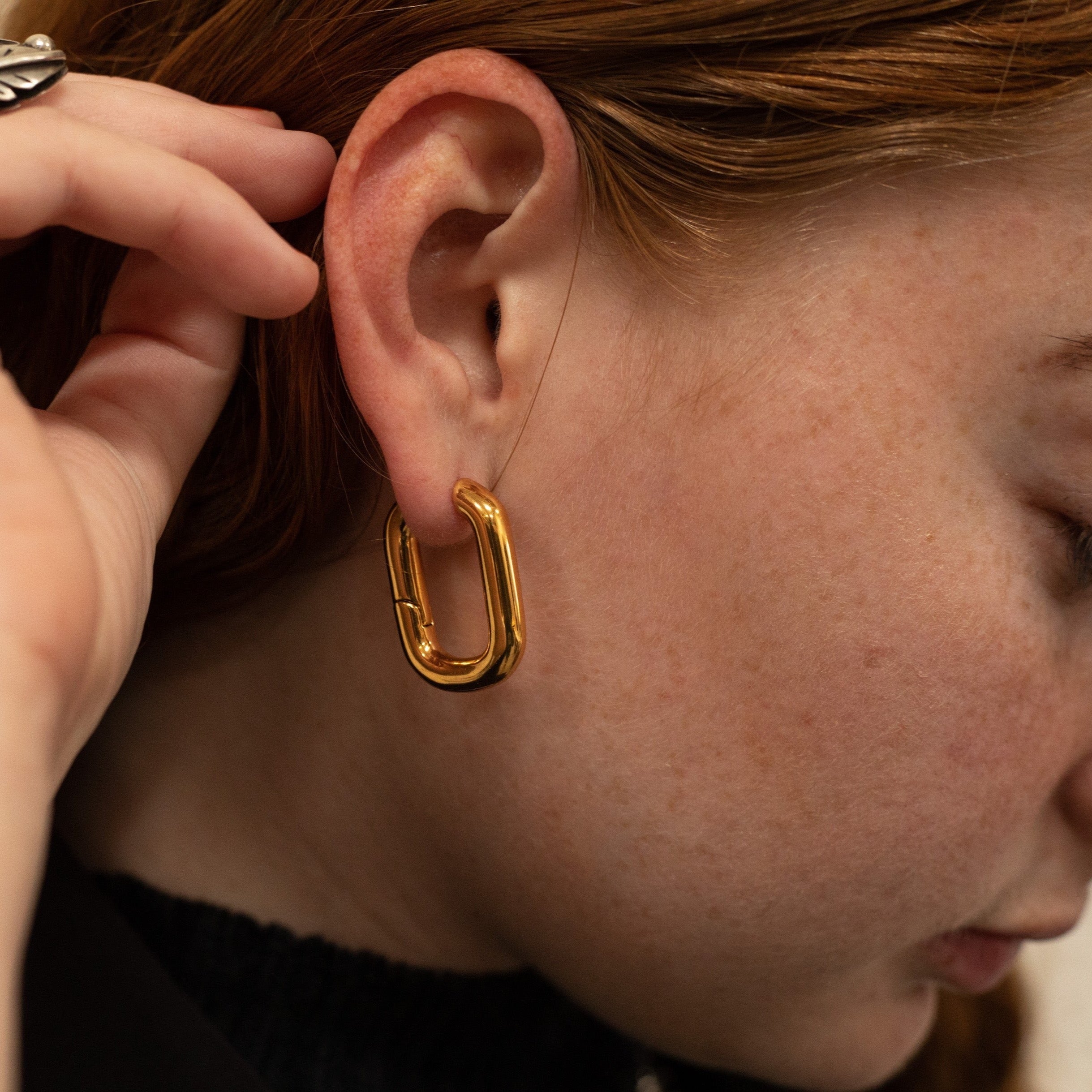 The Taryn Gold Rectangular Hoop Earrings on girl.