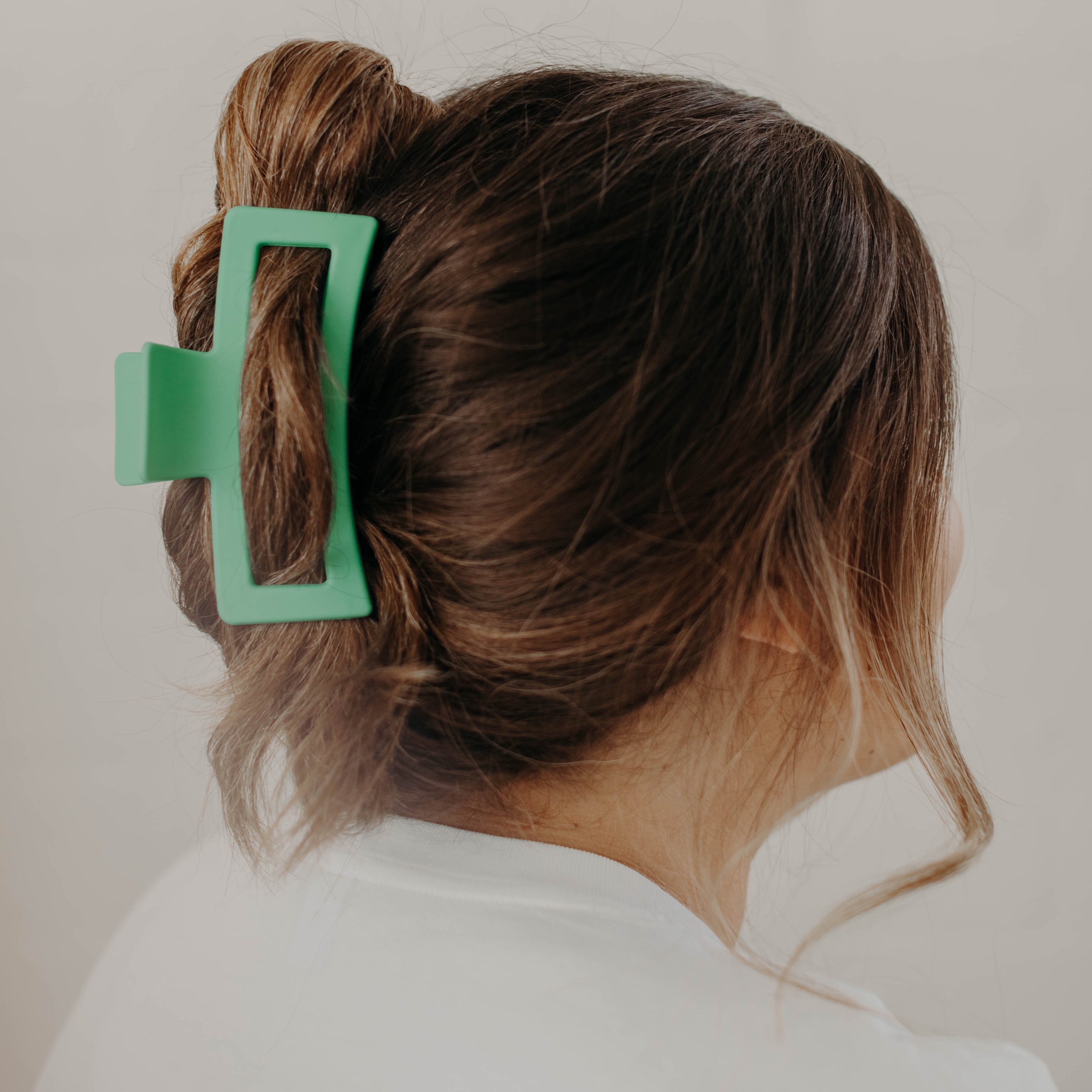 brunette hair in jade green hair clip