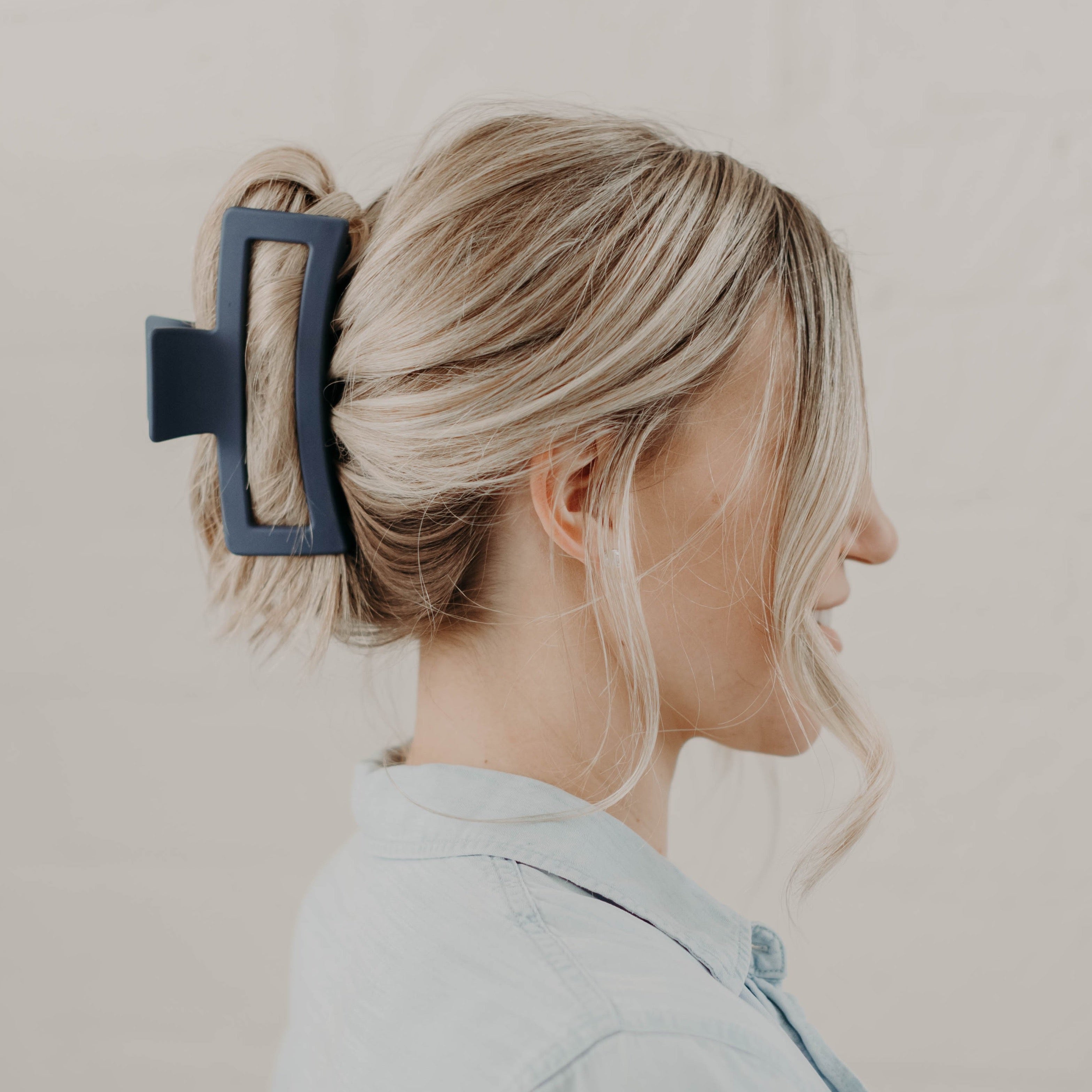 navy blue hair clip in blonde hair