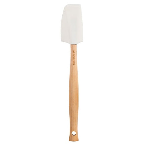 White baking spatula with wooden handle.