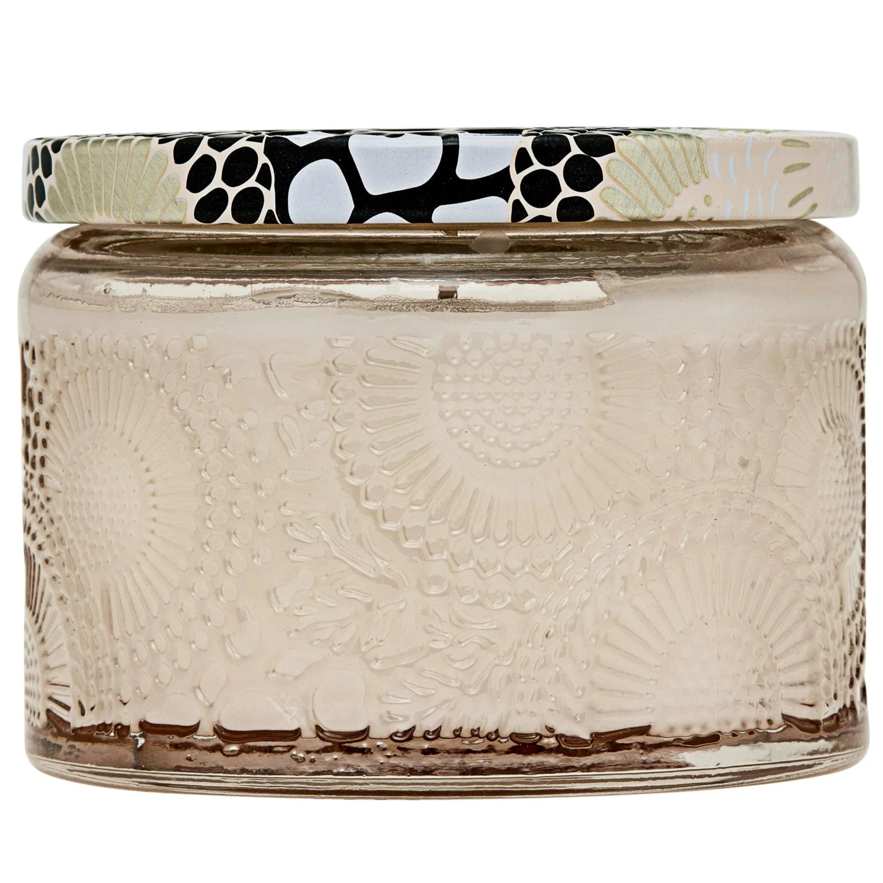 Candle in pale pink jar with black and gold floral lid.