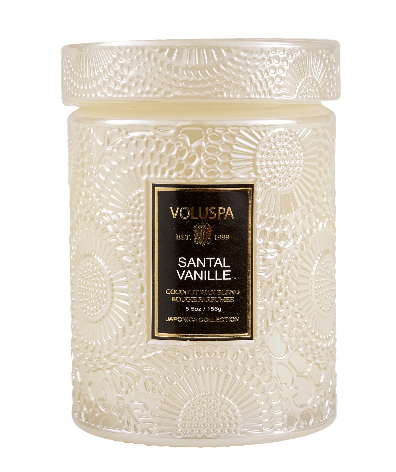 A white candle with a floral design that reads: "VOLUSPA SANTAL VANILLE" A coconut wax blend