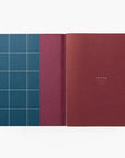 UMA Large Softcover Notebook | Dark Blue inside cover.